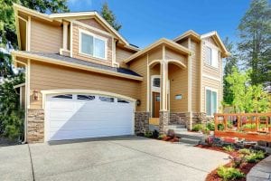 Big house with high porch and stone trim